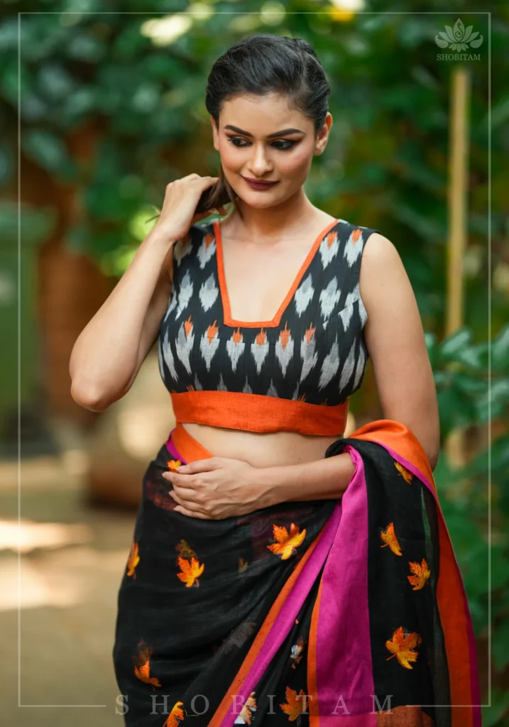 Black and Orange Cotton Ikkat Square Neck Sleeveless Blouse with Orange Handloom Border
